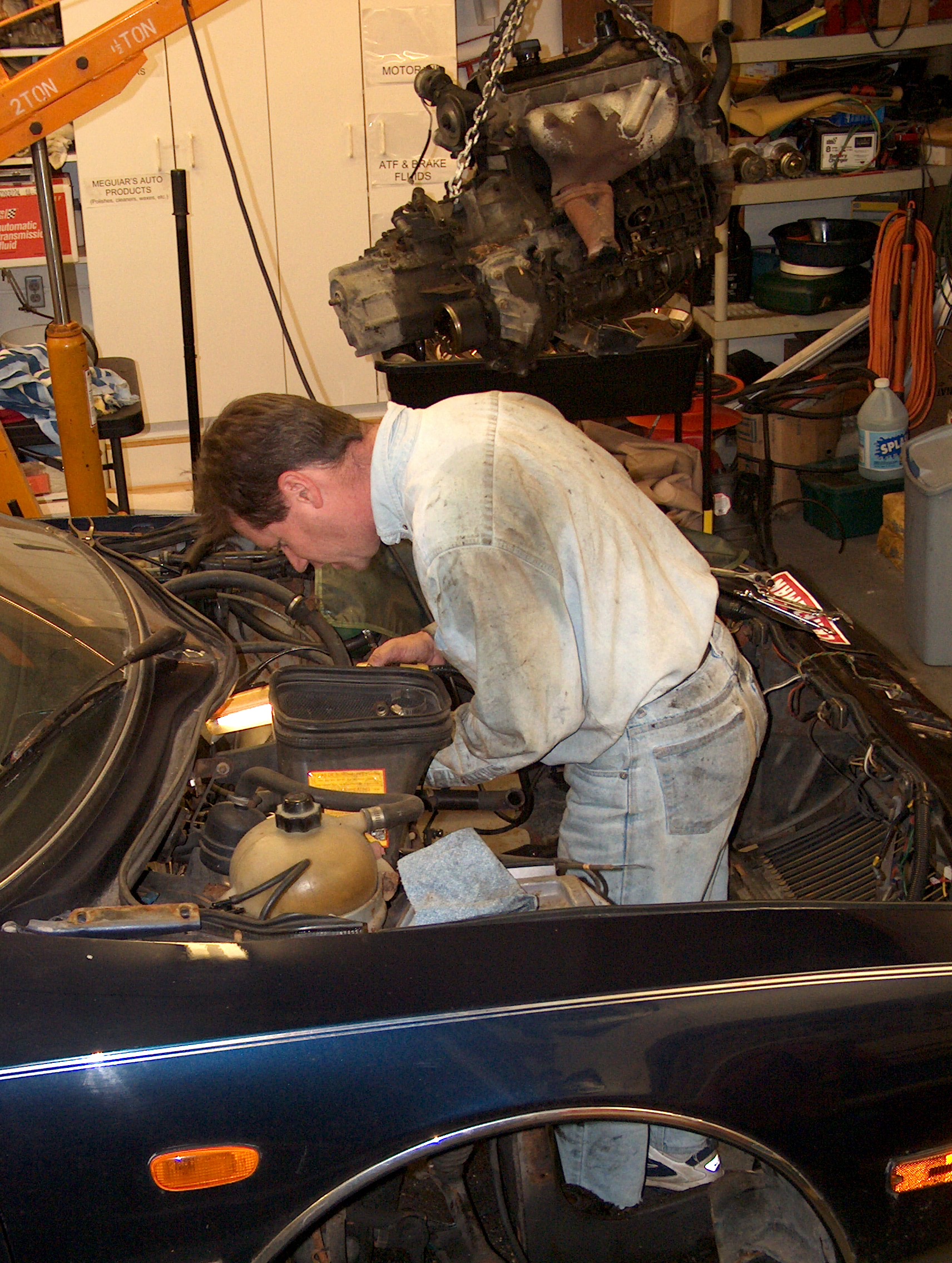Working on the 1980 CX Athena.  The engine is beside the car, not over it! January 2004.
